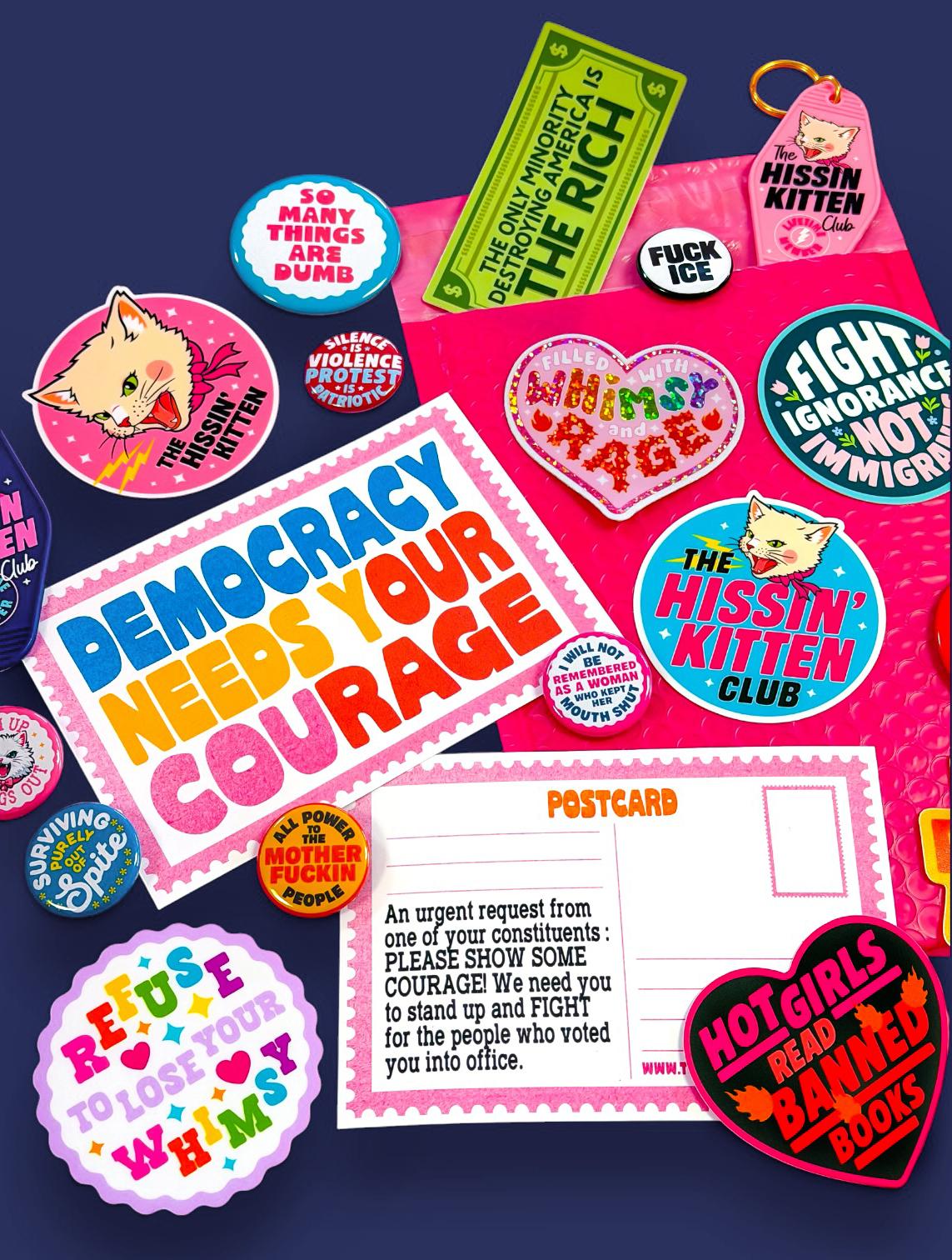 A colorful assortment of cat stickers, buttons, and postcards