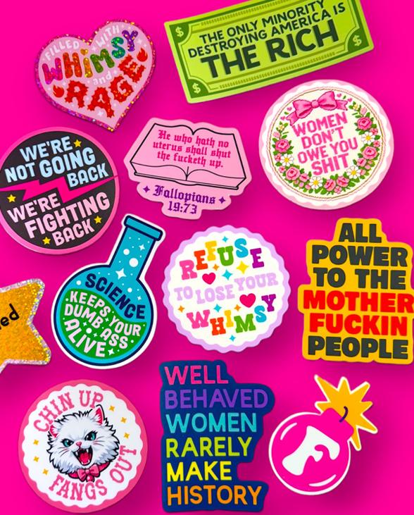 A sheet of colorful illustrated black cat stickers